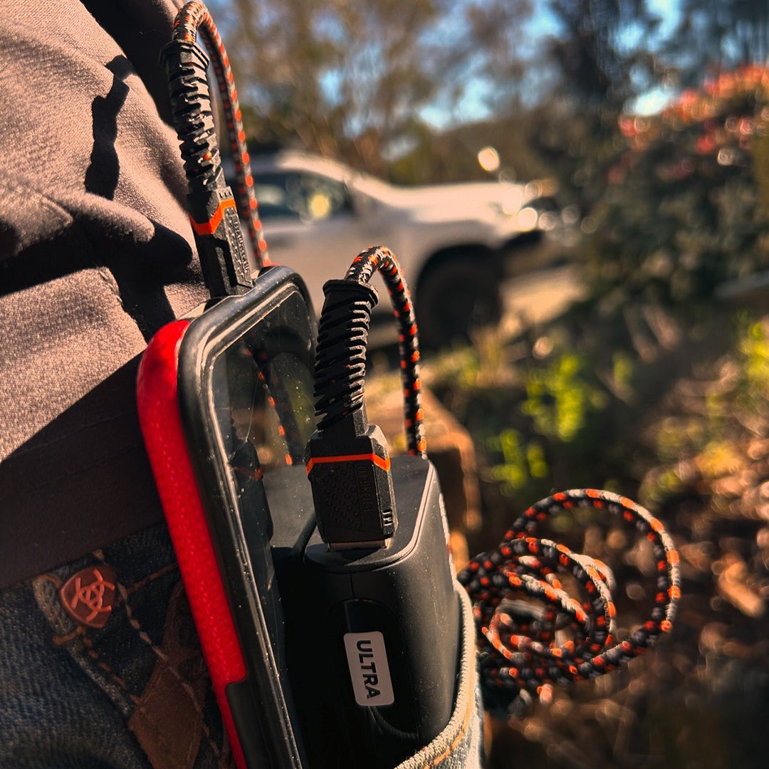 Man charging his phone with a Rugged Kevlar USB C to USB A Cable