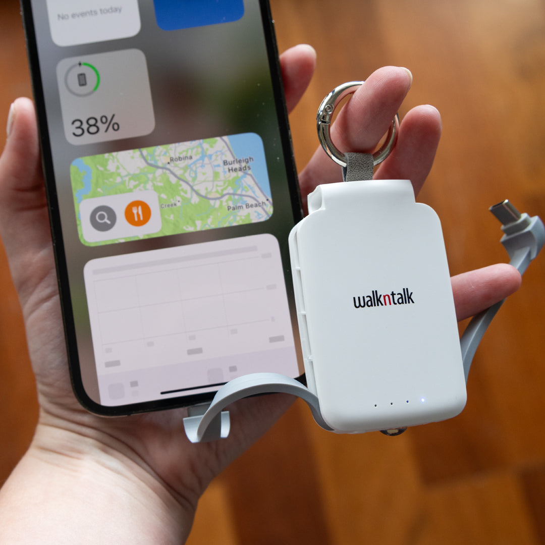 Phone being charged by a White Emergency Mini Power Bank Keychain