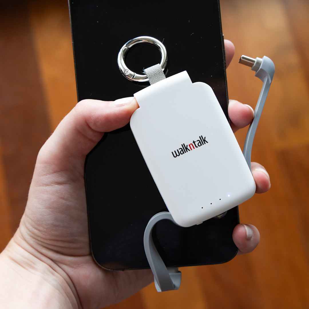 Phone connected to a White Emergency Mini Power Bank Keychain