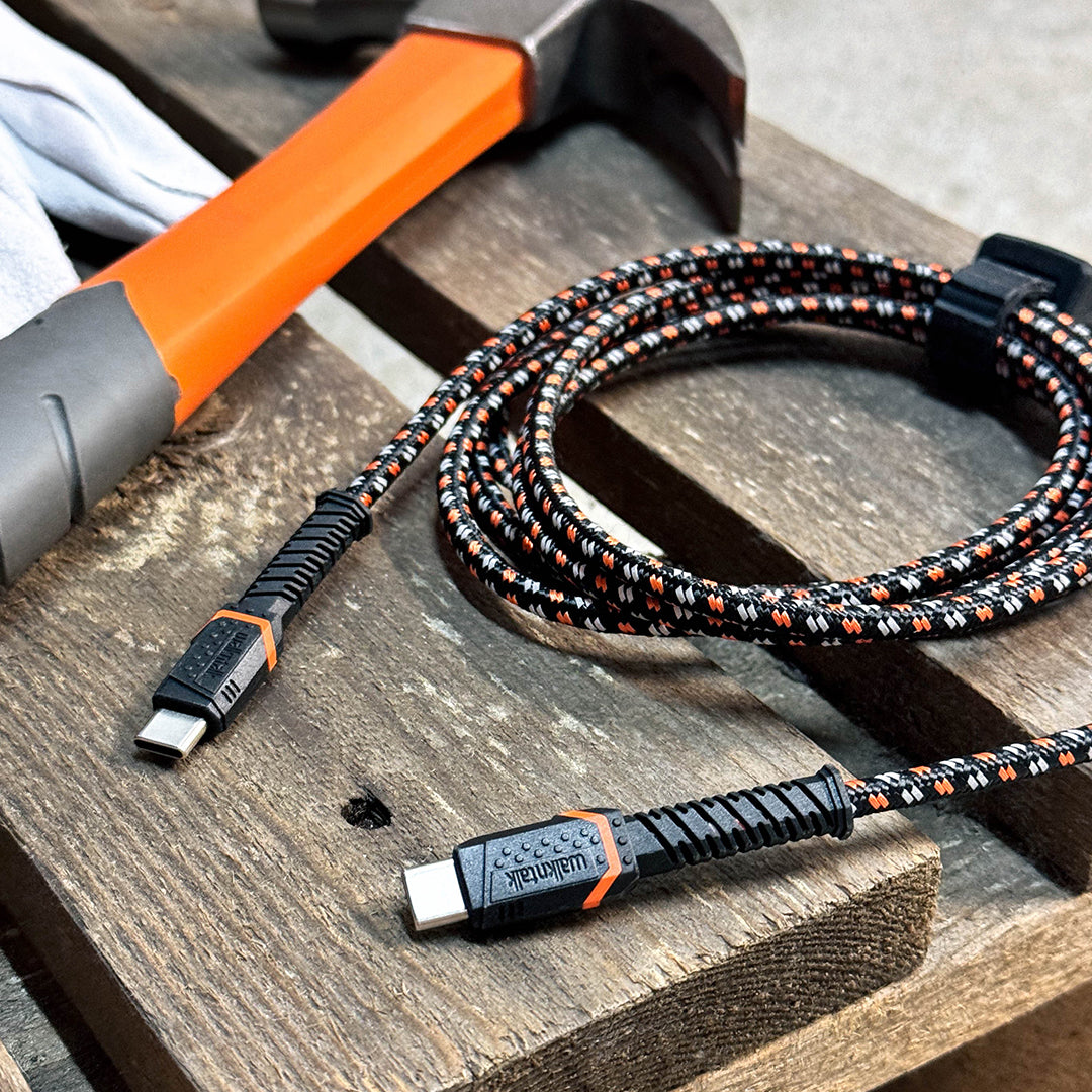 Rugged Kevlar USB C to USB C Cable on a bench next to a hammer