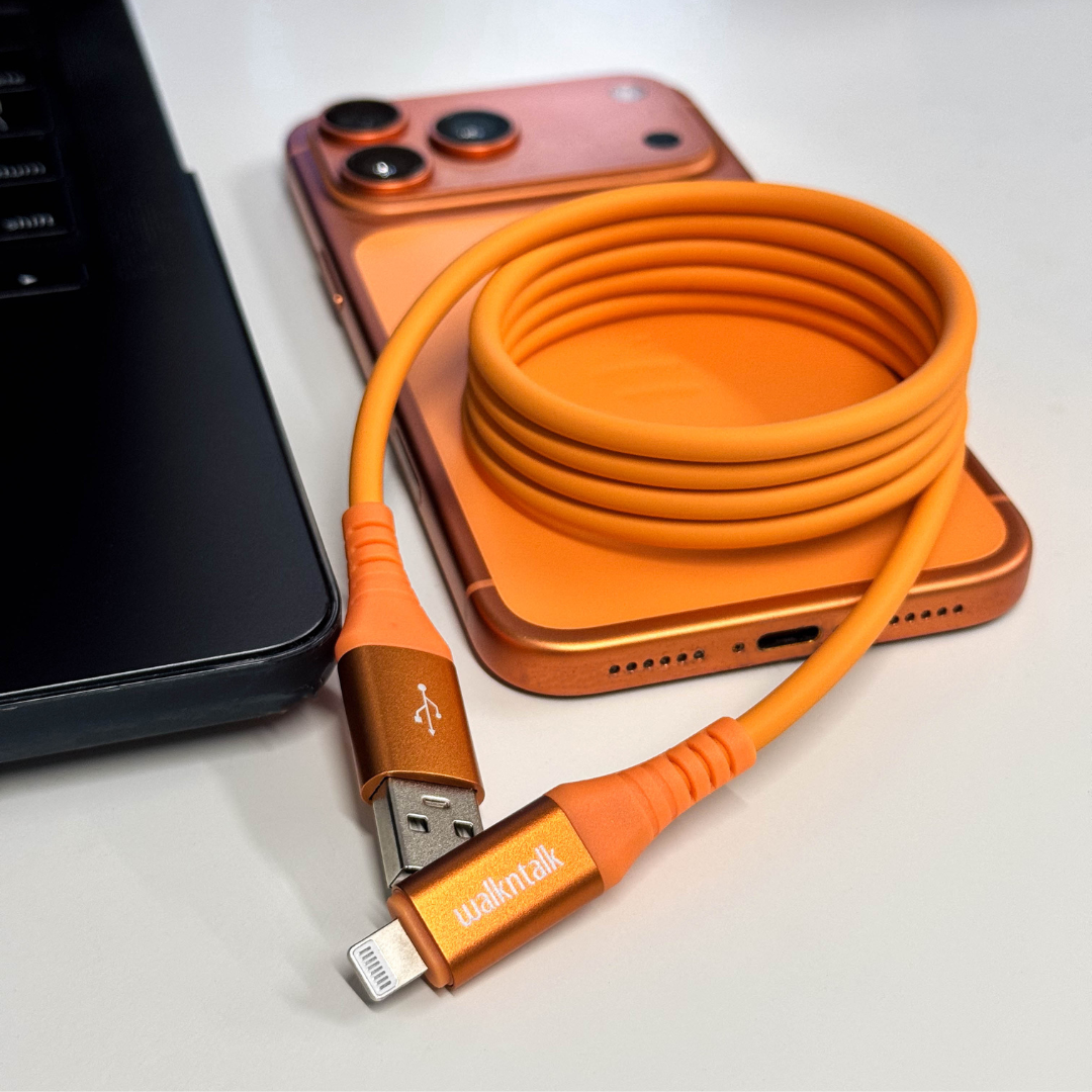 Orange 4 in 1 Magnetic Charging Cable with Lightning and USB C Connectors on an orange iPhone