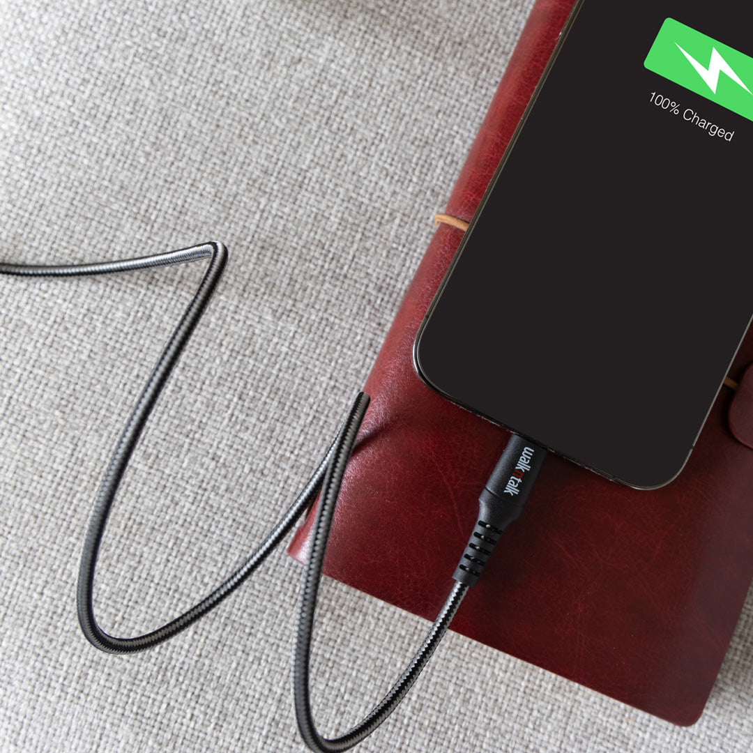 Phone being charged by a black 1m charge & sync USB C braided cable
