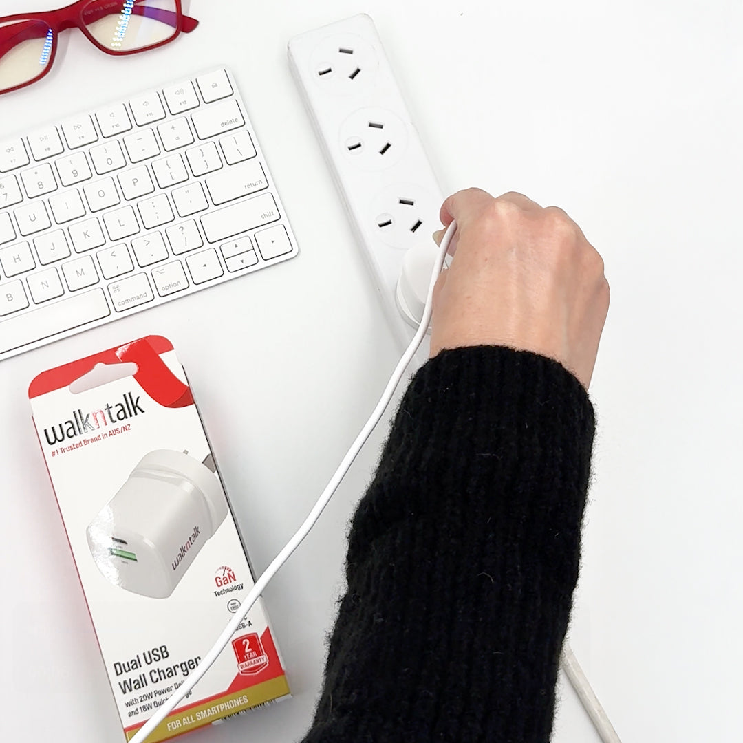 Woman plugging in 20W Dual USB Wall Charger